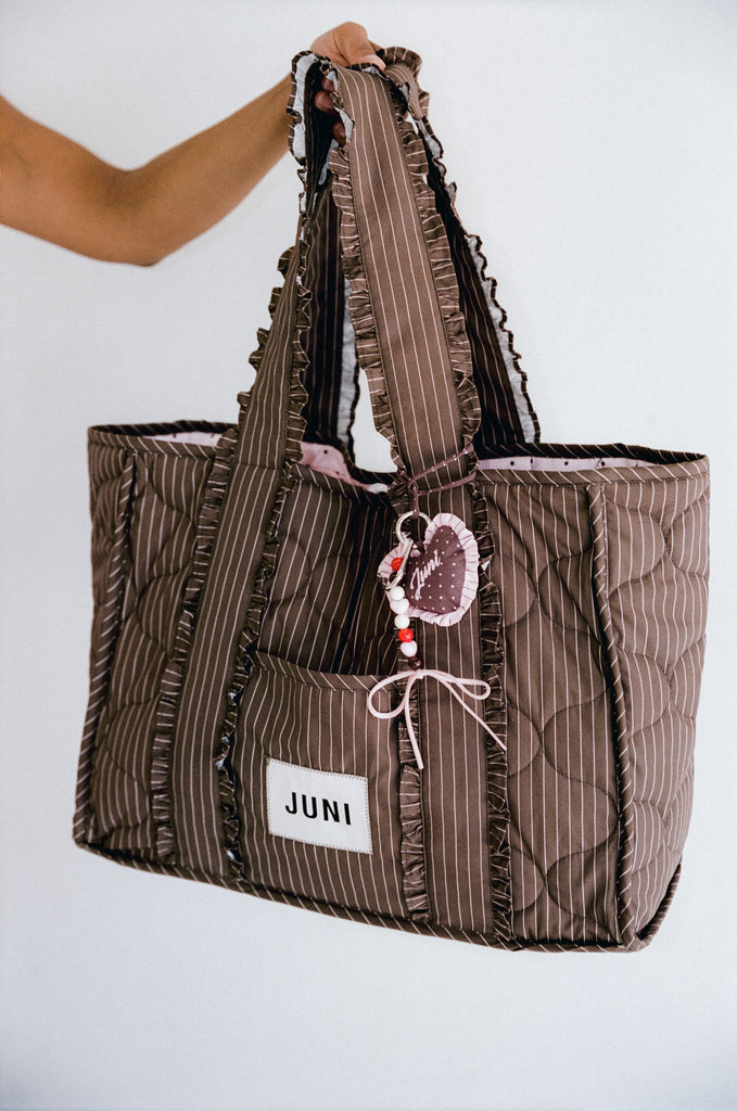Juni Heart Bag Charm Cocoa Spot - lifestyle shot