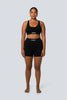 A model wearing the Lahana Active Sanaa Crop Top in Black shown from the front.