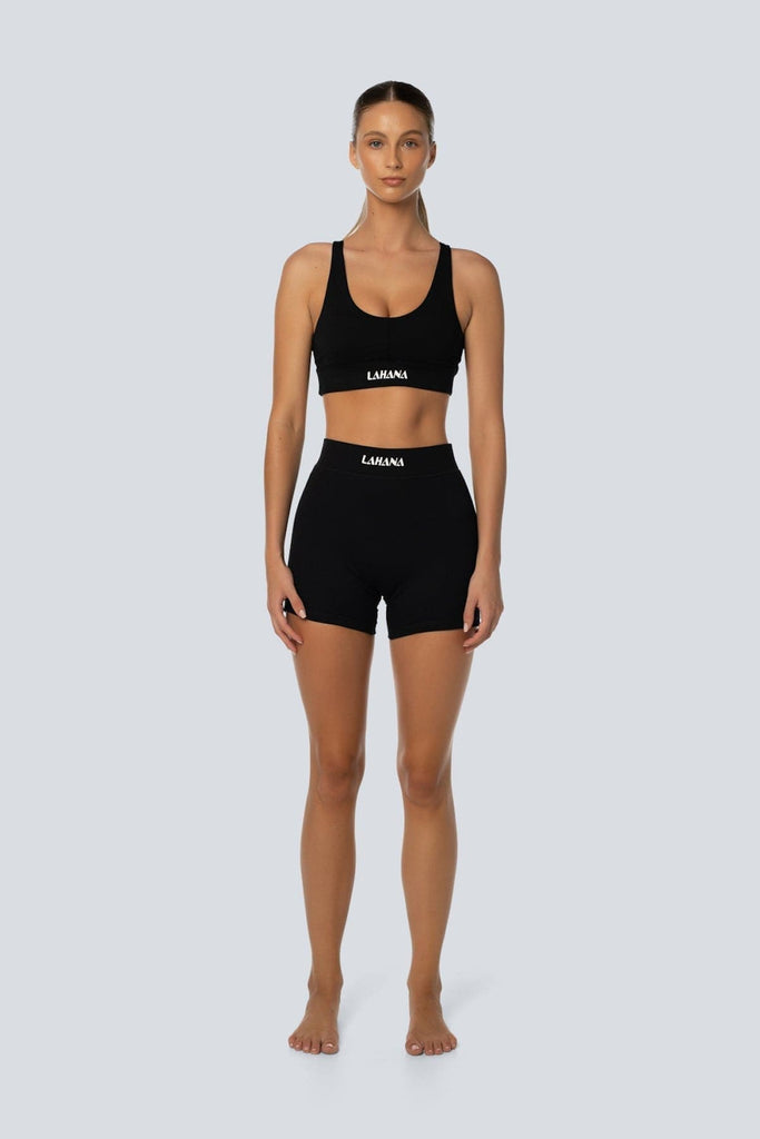 A model wearing the Lahana Active Sanaa Crop Top in Black shown from the front.