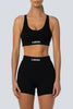 A model wearing the Lahana Active Sanaa Crop Top in Black with matching bike shorts.