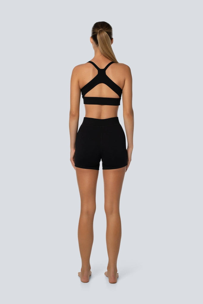 A model wearing the Lahana Active Sanaa Crop Top in Black shown from the back.